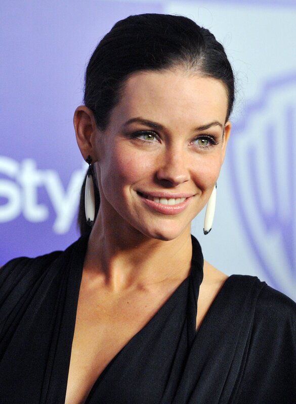 woman with dark hair smiling
