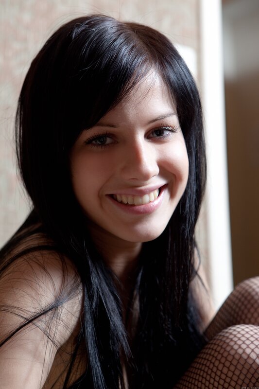 woman with dark hair smiling