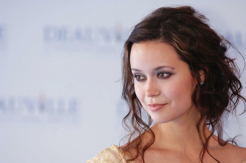 woman with dark hair smiling