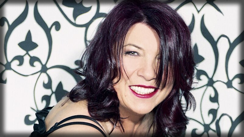 woman with dark hair smiling