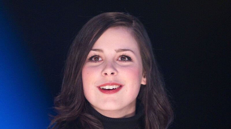 woman with dark hair smiling