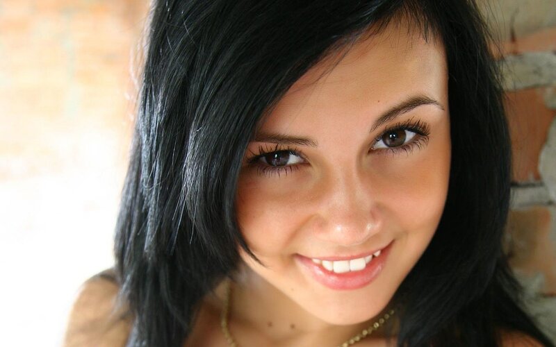 woman with dark hair smiling