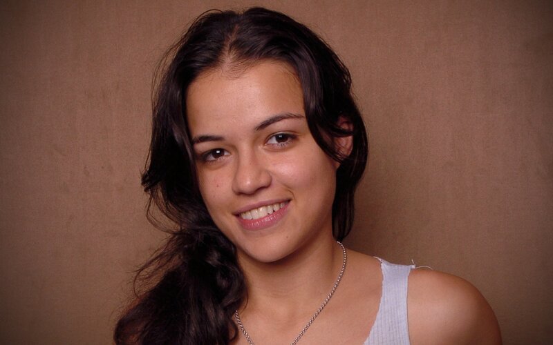woman with dark hair smiling
