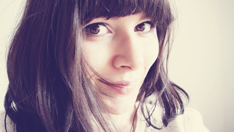 woman with dark hair smiling