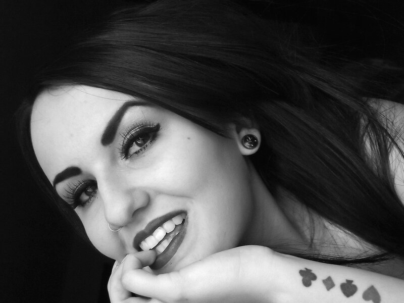 woman with dark hair smiling