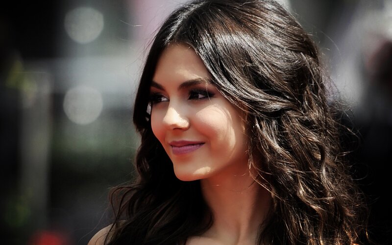 woman with dark hair smiling