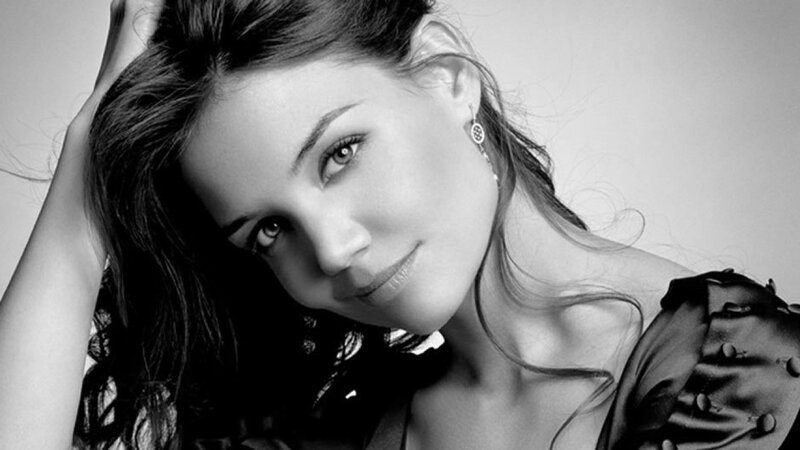 woman with dark hair smiling