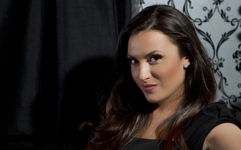 woman with dark hair smiling