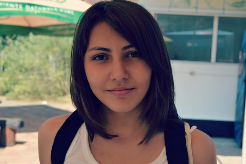 woman with dark hair smiling