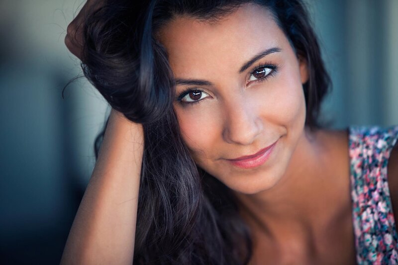 woman with dark hair smiling