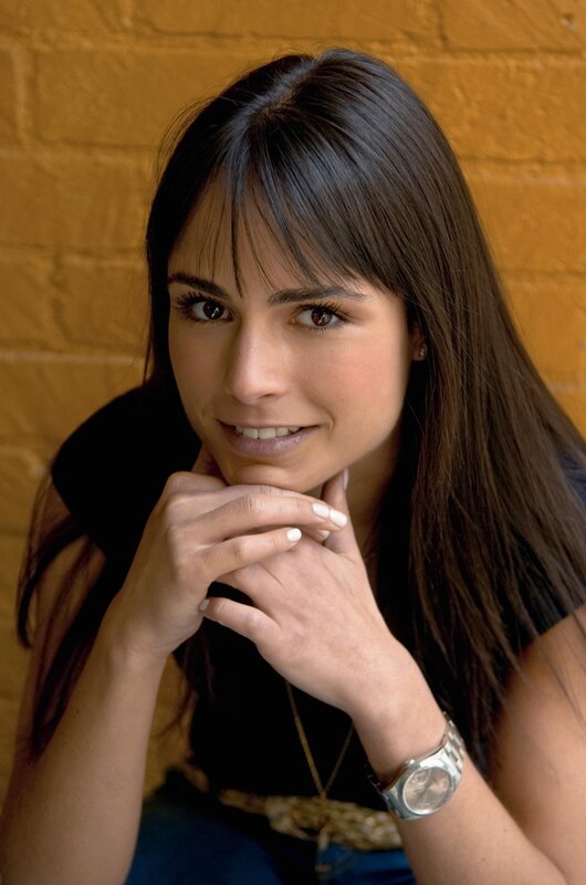 woman with dark hair smiling