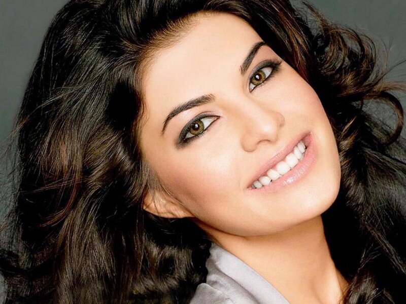 woman with dark hair smiling