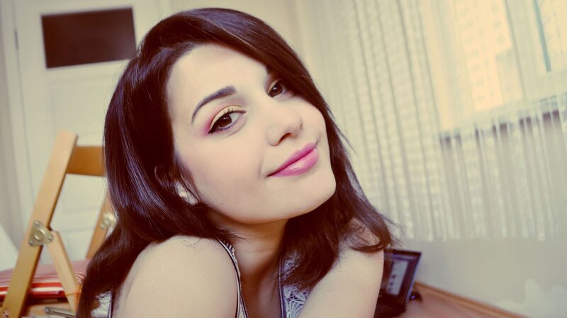 woman with dark hair smiling