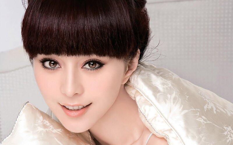 woman with dark hair smiling