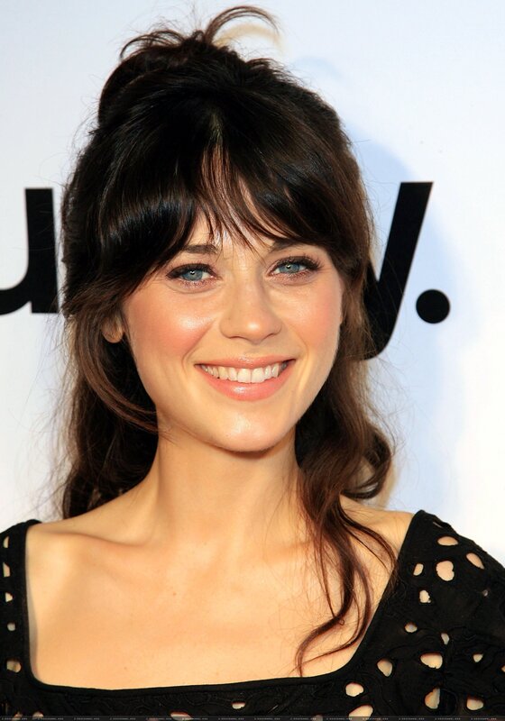 woman with dark hair smiling