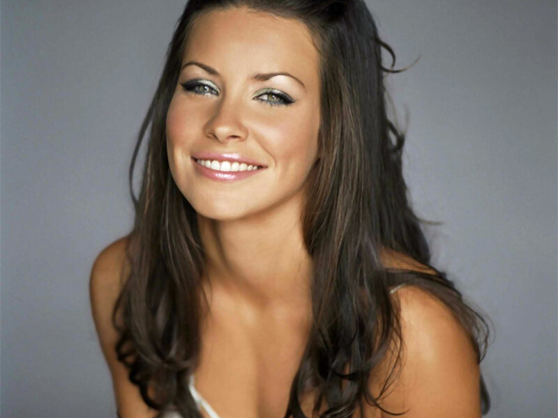woman with dark hair smiling