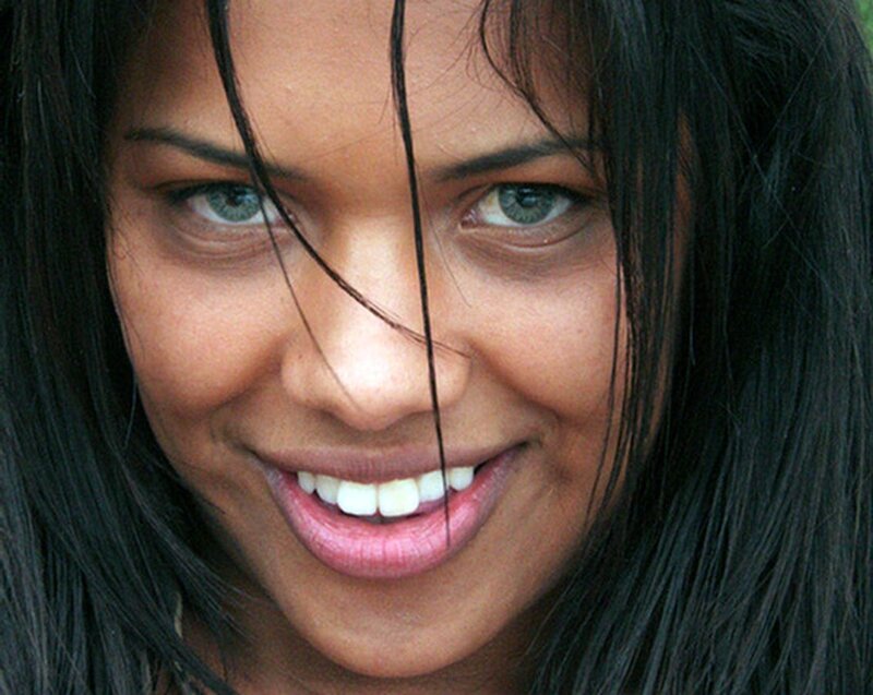 woman with dark hair smiling