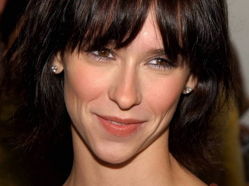 woman with dark hair smiling