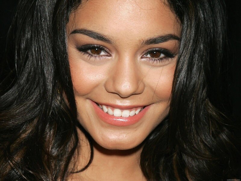 woman with dark hair smiling