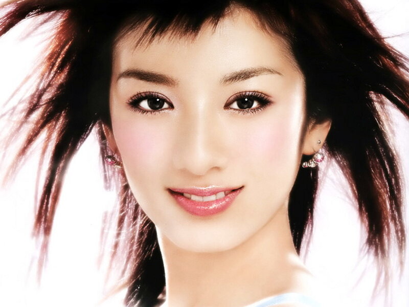 woman with dark hair smiling