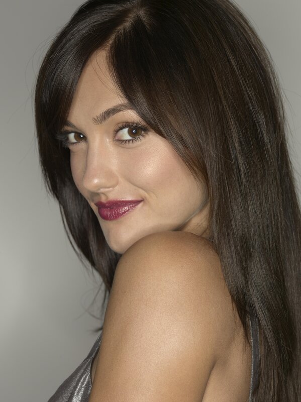woman with dark hair smiling