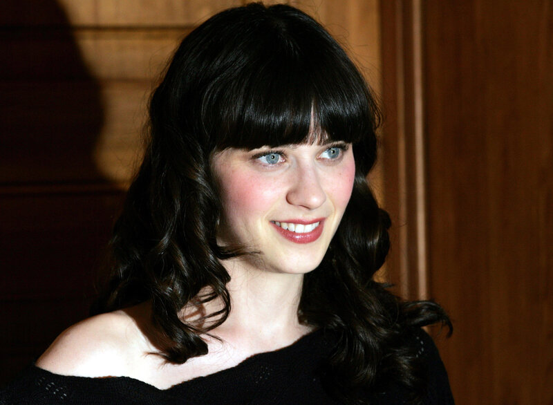 woman with dark hair smiling