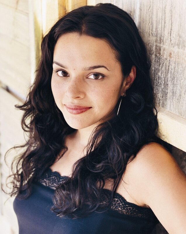 woman with dark hair smiling