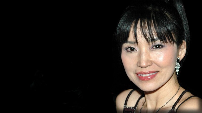 woman with dark hair smiling