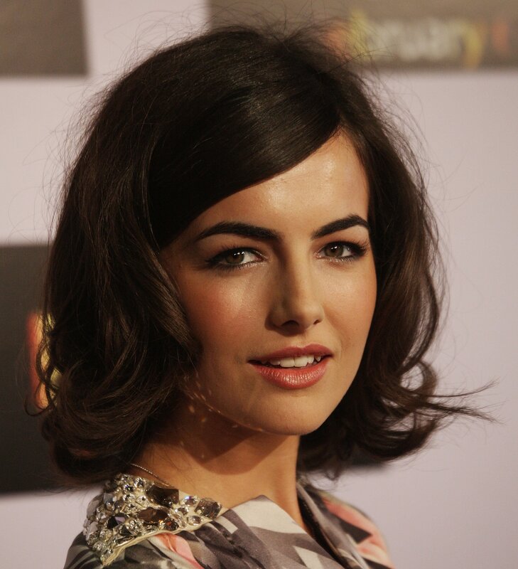 woman with dark hair smiling