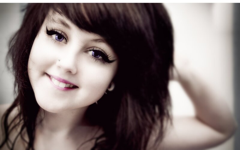 woman with dark hair smiling