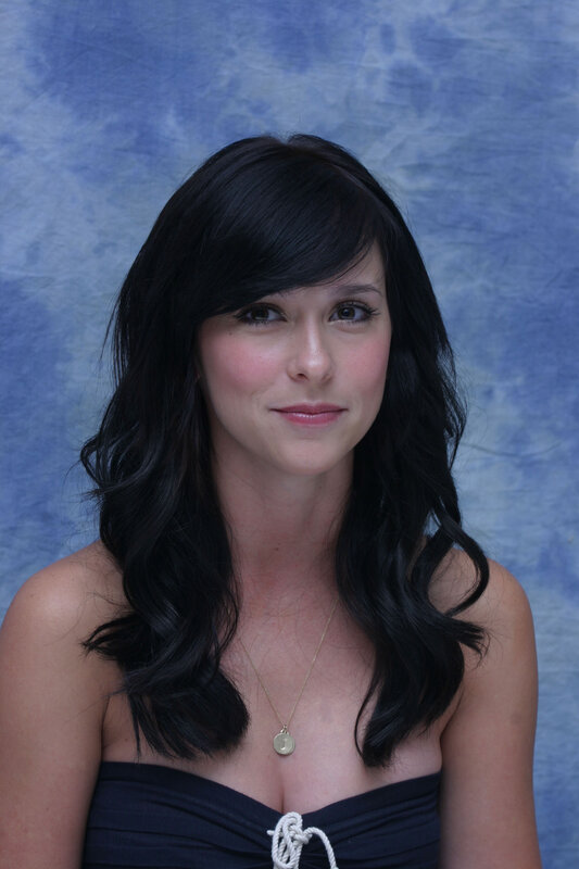 woman with dark hair smiling