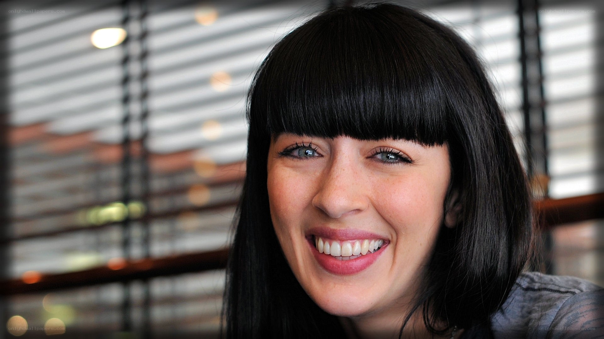 woman with dark hair smiling