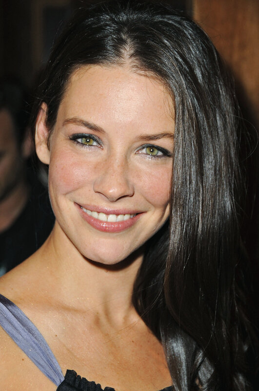 woman with dark hair smiling