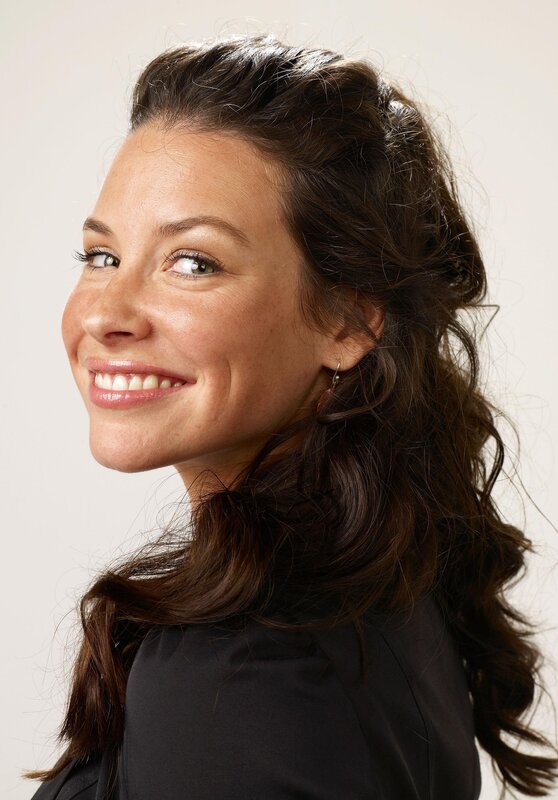 woman with dark hair smiling