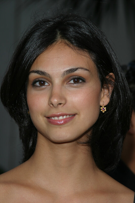 woman with dark hair smiling