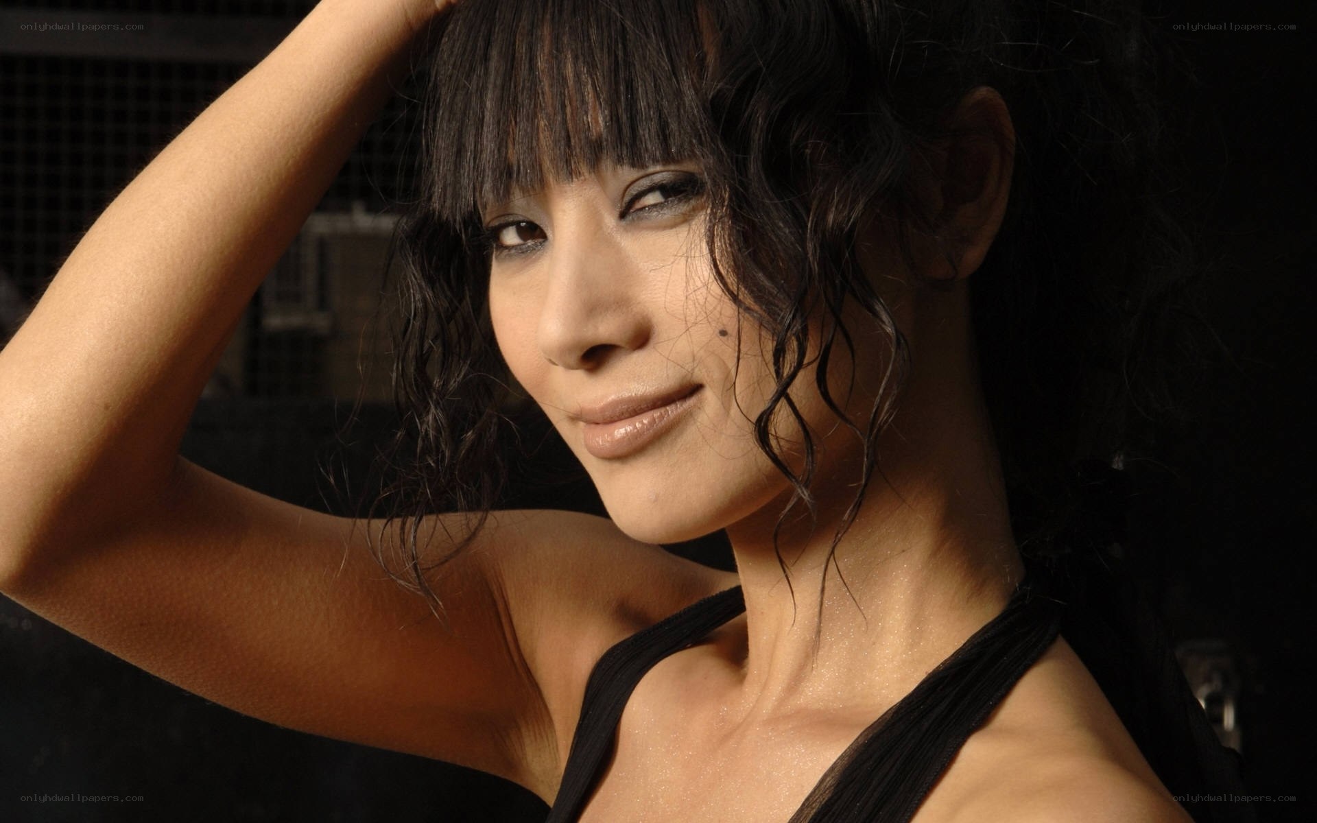 woman with dark hair smiling
