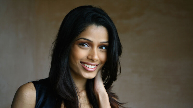 woman with dark hair smiling