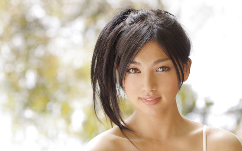 woman with dark hair smiling