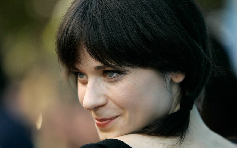 woman with dark hair smiling