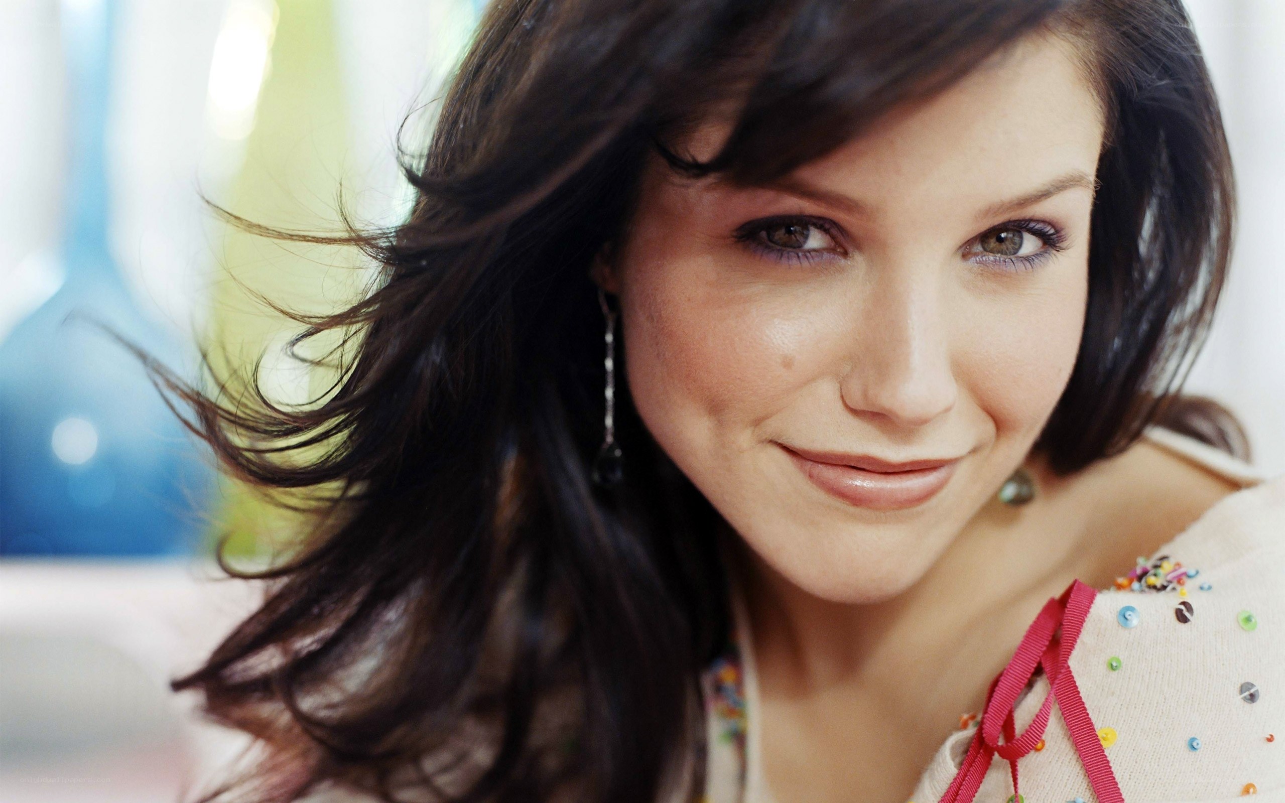 woman with dark hair smiling