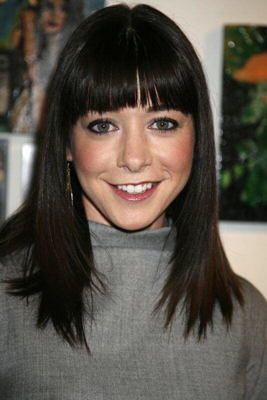 woman with dark hair smiling