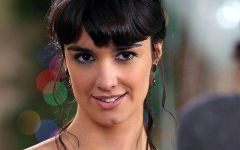 woman with dark hair smiling
