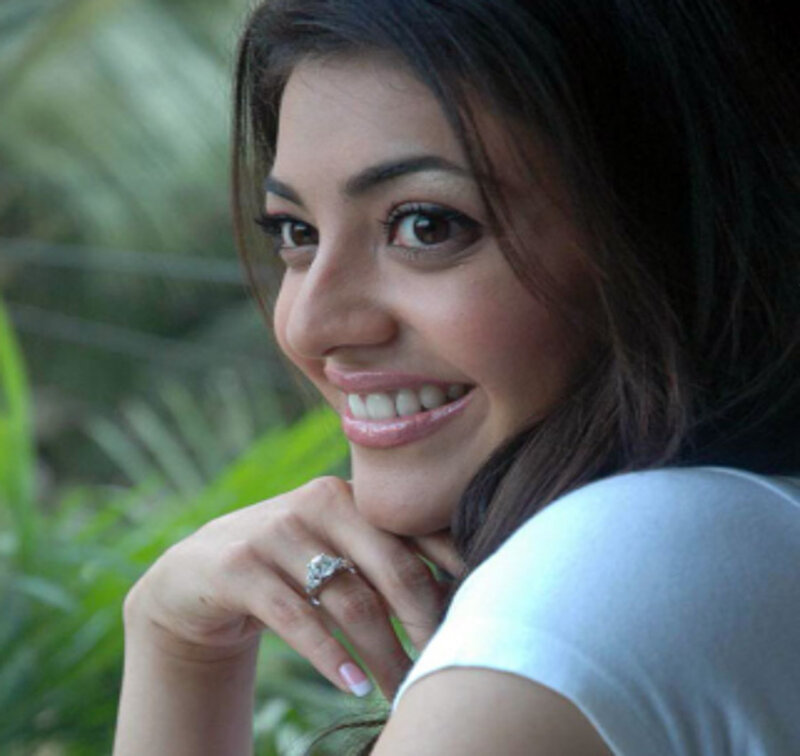 Woman with Dark Hair Smiling — Brown