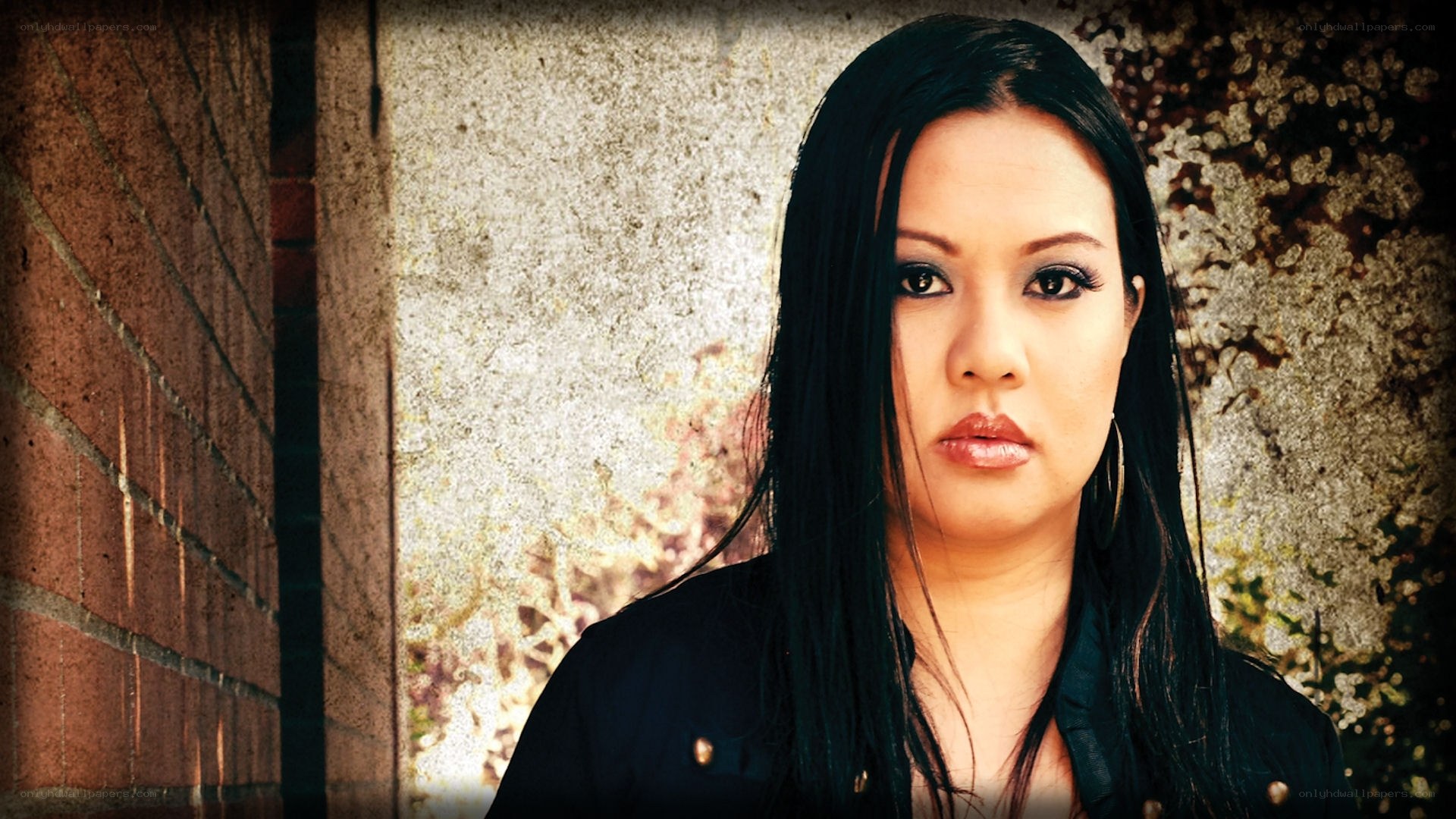 woman with dark hair standing outside