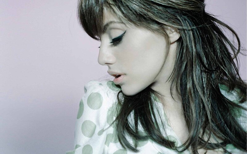 Woman with Dark Hair — White, Contemplative, Photograph, Polka Dots