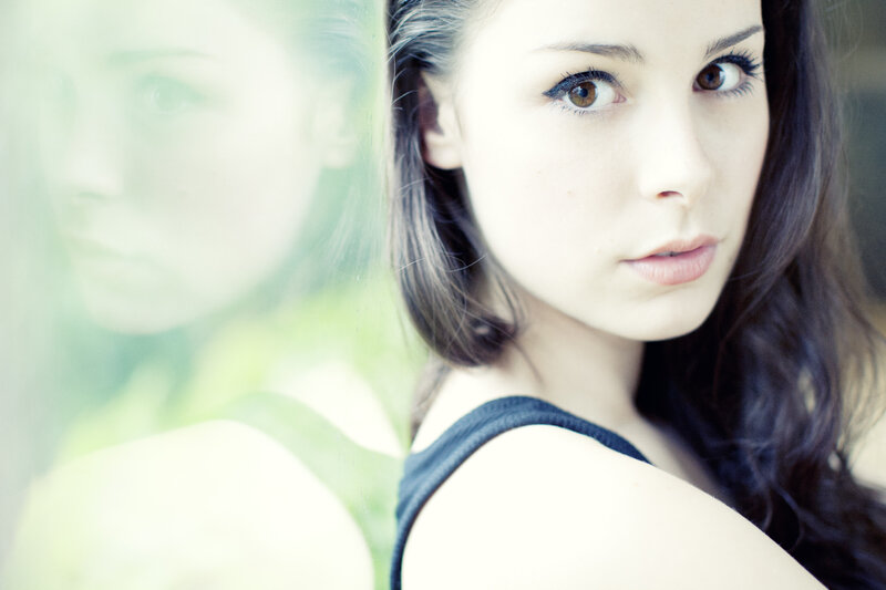 Woman with Dark Hair — White, Contemplative, Photograph, Reflection