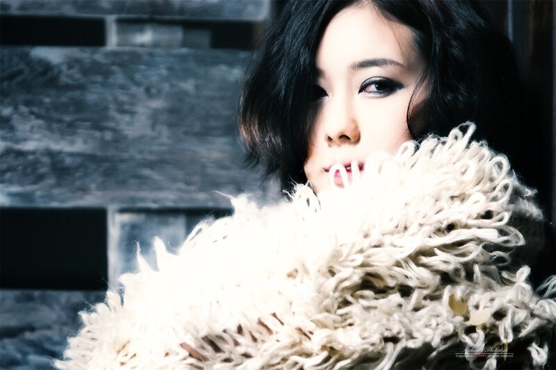 Woman with Dark Hair — White, Dramatic, Photograph, Fur Coat