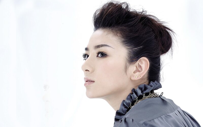Woman with Dark Hair — White, Neutral, Photograph, Earrings, Collar