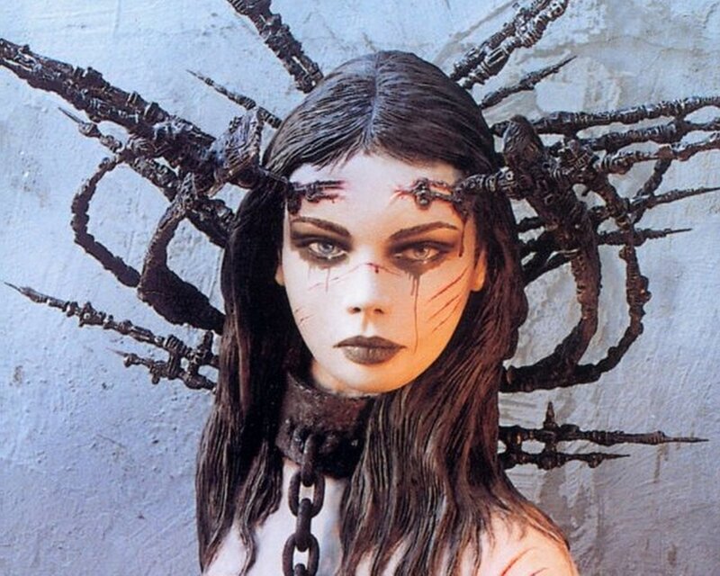 woman with dark headpiece