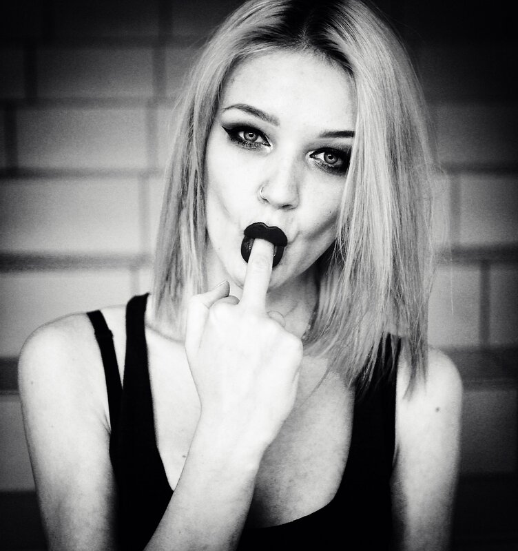 woman with dark lipstick and makeup